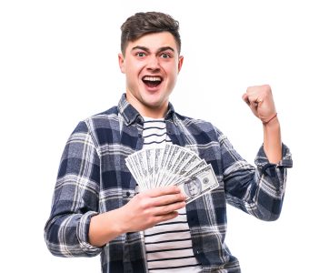 man in casual clothing holding fan of money
